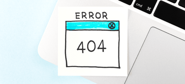 How to set up redirects in WordPress. Image depicts the corner of a laptop. There is a sticky note on it that reads Error 404